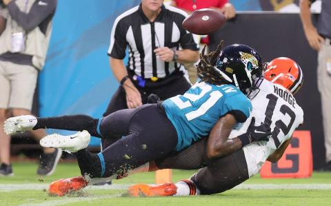 Jacksonville Jaguars cornerback Sidney Jones (21) breaks up a touchdown pass attempt intended for Cleveland Browns wide receiver KhaDarel Hodge during a preseason game at TIAA Bank Field on Aug. 14 in Jacksonville. (JOHN KUNTZ/TNS)