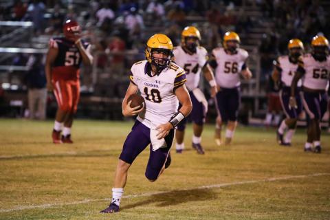 Columbia quarterback Kade Jackson finds running room Friday at Vanguard. (BRENT KUYKENDALL/Lake City Reporter)