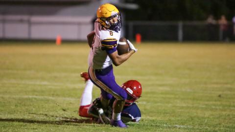 Columbia receiver Jace Hoskey tries to escape a tackle against Vanguard during the teams' Preseason Classic on Aug. 20. (BRENT KUYKENDALL/Lake City Reporter)