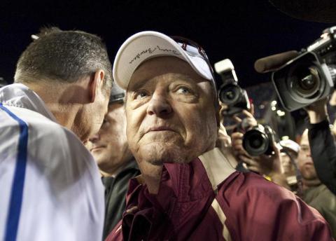 Florida State head football coach Bobby Bowden wears a dejected expression as he turns to leave Florida coach Urban Meyer after congratulating Meyer following Florida's 37-10 win over Florida State on Nov. 28, 2009, in Gainesville. Bowden died Sunday after a battle with pancreatic cancer. (AP FILE) 