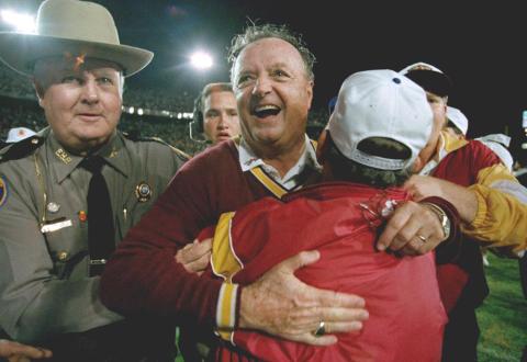 Florida State University head football coach Bobby Bowden, center, receives a congratulatory hug after FSU defeated Nebraska 18-16 in the Orange Bowl on  Jan. 1, 1994, in Miami. (AP FILE)