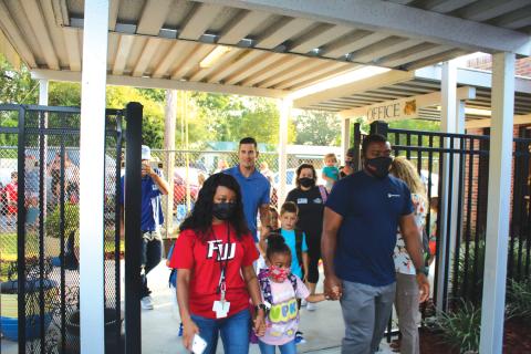Parents and guardians drop off their children at the first day of school on Aug. 11 at Eastside Elementary. (TONY BRITT/Lake City Reporter)