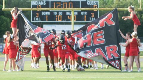Fort White receiver Najeeb Smith leads his team on the field prior to last week's Preseason Classic against Middleburg. (CHRISTINA FEAGIN/Special to the Reporter)