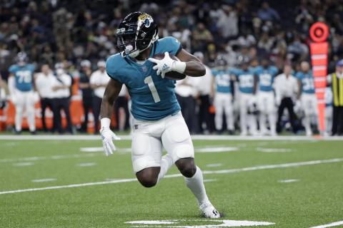 Jacksonville Jaguars running back Travis Etienne (1) carries in the first half of Monday's preseason game in New Orleans. (DERICK HINGLE/Associated Press)