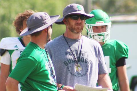Suwannee coach Kyler Hall (right) looks on during spring practice in April. (JAMIE WACHTER/Lake City Reporter)