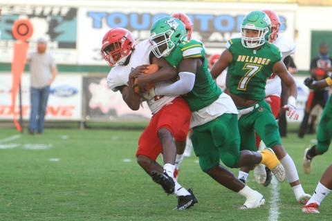 Suwannee linebacker Andrew Brown wraps up a Hamilton County ballcarrier. (PAUL BUCHANON/Special to the Reporter)