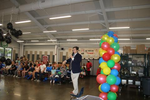Belmont Academy principal Ron Barker addresses parents and students at the school’s back to school bash. (TONY BRITT/Lake City Reporter)