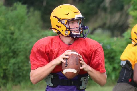 Columbia quarterback Kade Jackson drops back to pass during practice on Aug. 6. (JORDAN KROEGER/Lake City Reporter)