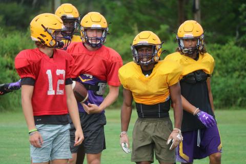 Columbia quarterback Evan Umstead (from left), receiver Brae Deal, quarterback Kade Jackson, running back Leo Robinson and receiver Jace Hoskey react after a play during practice on Aug. 6. (JORDAN KROEGER/Lake City Reporter)