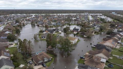 Flooded streets and homes are shown in the Spring Meadow subdivision in LaPlace after Hurricane Ida moved through on Monday. (STEVE HELBER/Associated Press)