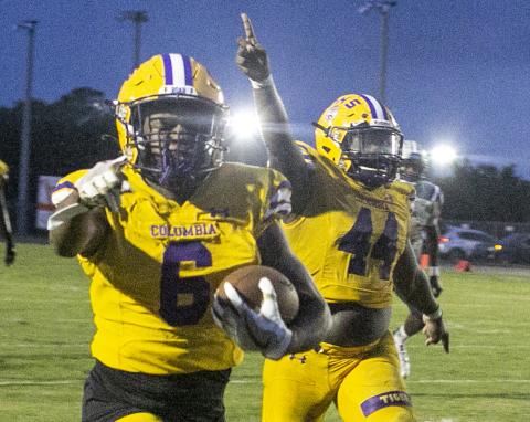 Columbia receiver Tray Tolliver returns a punt for a touchdown against American Heritage-Delray on Aug. 27.  (JEN CHASTEEN/Special to the Reporter)