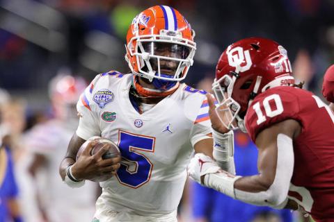 Florida quarterback Emory Jones (5) fends off Oklahoma safety Pat Fields (10) during last year's Cotton Bowl on Dec. 30, 2020, in Arlington, Texas. (RONALD MARTINEZ/Getty Images/TNS)