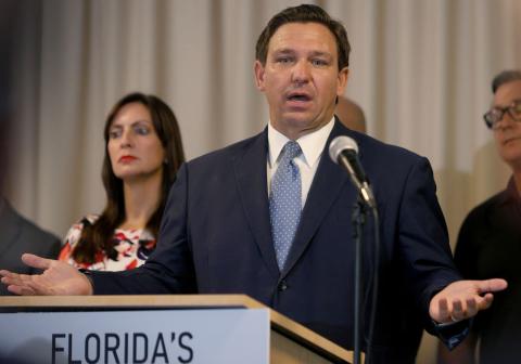 Florida Gov. Ron DeSantis speaks during an event to give out bonuses to first responders held at the Grand Beach Hotel Surfside on Aug. 10 in Surfside. (JOE RAEDLE/Getty Images/TNS)