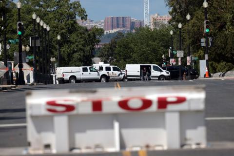 First responders arrive on the scene to investigate a report of an explosive device in a pickup truck near the Library of Congress on Capitol Hill on Thursday in Washington, D.C. The suspect has since surrendered and has been arrested after the area was evacuated. (WIN MCNAMEE/Getty Images/TNS)