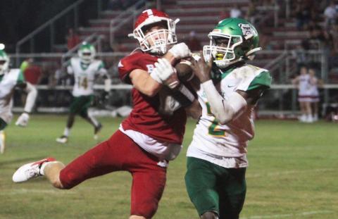 Suwannee defensive back Jay Smith takes a pass away from a Dixie County receiver for a pick-six on Friday night. (PAUL BUCHANAN/Special to the Reporter)