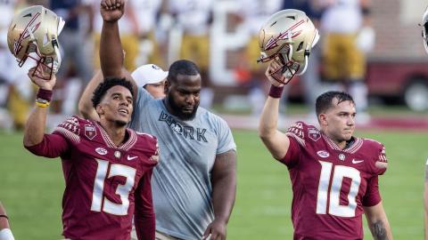Florida State quarterbacks Jordan Travis (13) and McKenzie Milton (10), and defensive tackle Robert Cooper (91) walk off the field before their game against Notre Dame at Doak Campbell Stadium on Sept. 5 in Tallahassee. (WILLIE J. ALLEN/Orlando Sentinel/TNS) Jr.