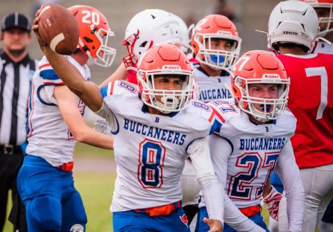 Branford's Josue Sierra (8) and Brice Criggall (27) celebrate after Sierra recovers a fumble against Williston on Aug. 27. (BRIAN LEWIS/Special to the Reporter)