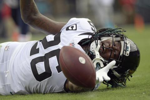 Jacksonville Jaguars cornerback Shaquill Griffin (26) can't quite hang on to a possible interception against the Denver Broncos on Sept. 19 in Jacksonville. (PHELAN M. EBENHACK/Associated Press)