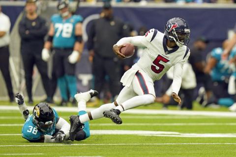 Houston Texans quarterback Tyrod Taylor (5) breaks away from Jacksonville Jaguars safety Andre Cisco (38) on Sept. 12 in Houston. (ERIC CHRISTIAN SMITH/Associated Press)