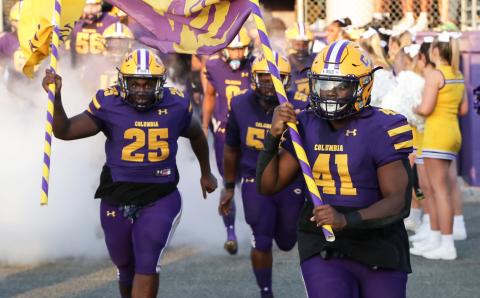 Columbia defensive linemen Jihycein Weston (25) and Julius Moreland (41) lead the team out of the tunnel prior to their game against Bolles on Sept. 3. (BRENT KUYKENDALL/Lake City Reporter)