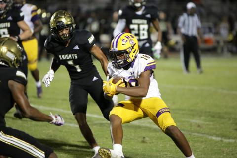 Columbia receiver Keeven Young runs up the field after a catch against Oakleaf on Sept. 10. (BRENT KUYKENDALL/Lake City Reporter)