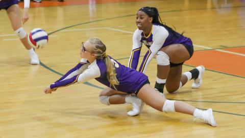 Columbia's Bailey Campbell (left) and Brandi Oliver (right) dive for a ball against P.K. Yonge on Tuesday night. (BRENT KUYKENDALL/Lake City Reporter)