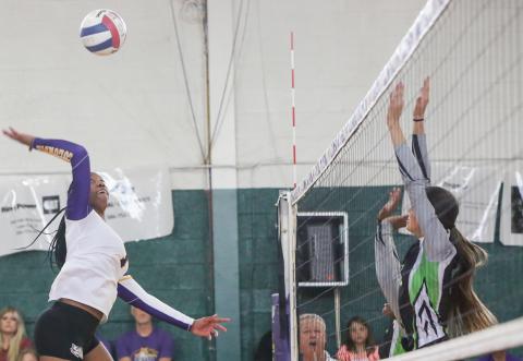 Columbia’s Brandi Oliver sends a shot over the net against Suwannee on Tuesday night. (BRENT KUYKENDALL/Lake City Reporter)