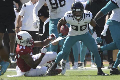 Jacksonville Jaguars wide receiver Jamal Agnew (39) gets away from Arizona Cardinals tight end Demetrius Harris (86) on his way to a 109-yard touchdown run on a missed field goal by the Arizona Cardinals on Sept. 26 in Jacksonville. (PHELAN M. EBENHACK)