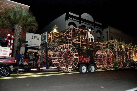 A parade float rolls down the street at last December’s Christmas on the Square in Live Oak. (FILE)