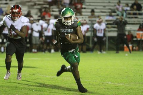 Suwannee running back Malachi Graham takes a carry up the field against Westside on Sept. 3 (PAUL BUCHANAN/Special to the Reporter)