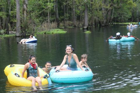 Rain (from left), Ivan, Nicolette and Theodore Sacino float down the Ichetucknee on their tubes Monday afternoon while celebrating Labor Day. (TONY BRITT/Lake City Reporter)