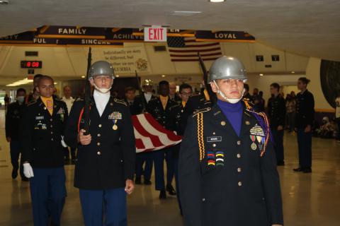 Ethan Moore (center), CHS Battalion commander for the Tiger Battalion, leads JROTC cadets through students and staff followed by Noah Smith (left) and other cadets Friday morning during the JROTC’s annual memorial march in honor of 9/11 victims. (TONY BRITT/Lake City Reporter)