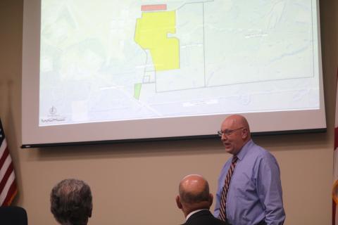 Florida Gateway College President Lawrence Barrett discusses concerns the college has with Lake City and Columbia County officials in a joint meeting Tuesday. (TONY BRITT/Lake City Reporter)