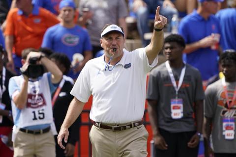 Florida head coach Dan Mullen directs player warmups before a game against Alabama on Sept. 18 in Gainesville. (JOHN RAOUX/Associated Press)