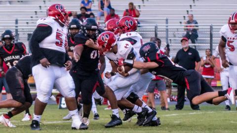 Fort White’s defense converges for a tackle against Hamilton County on Sept. 10. (CHRISTINA FEAGIN/Special to the Reporter)