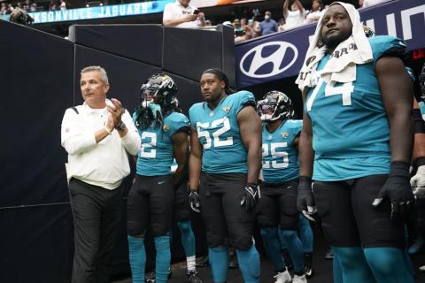 Jacksonville Jaguars coach Urban Meyer, left, prepares to lead his team onto the field before a game against the Houston Texans on Sept. 12 in Houston. (SAM CRAFT/Associated Press)