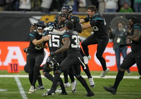 Jacksonville Jaguars kicker Matthew Wright  (center) celebrates after kicking a game-winning field goal to defeat the Miami Dolphins at the Tottenham Hotspur stadium in Oct. 17 in London, England. (MATT DUNHAM/Associated Press)