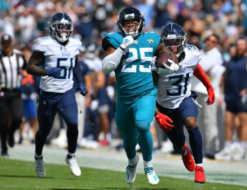 Jacksonville Jaguars running back James Robinson eludes Titans defenders on a long second-quarter run to the 12-yard line during first quarter action on Oct. 10 in Jacksonville. (TRIBUNE NEWS SERVICE)
