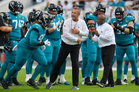 Jacksonville Jaguars head coach Urban Meyer and assistant head coach Charlie Strong get their players motivated before the start of Sunday's game against the Tennessee Titans in Jacksonville. (BOB SELF/Florida Times-Union/TNS)