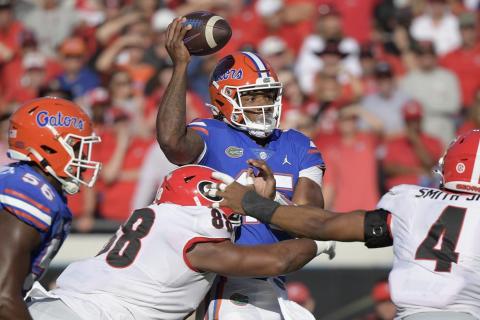 Florida quarterback Anthony Richardson is sacked by Georgia defensive lineman Jalen Carter on Saturday in Jacksonville. (PHELAN M. EBENHACK/Associated Press)