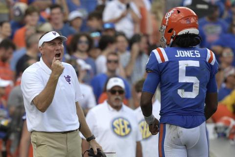 Florida head coach Dan Mullen, left, calls out instructions in front of quarterback Emory Jones (5) during a game against Vanderbilt on Oct. 9 in Gainesville. (AP Photo/PHELAN M. EBENHACK/Associated Press)