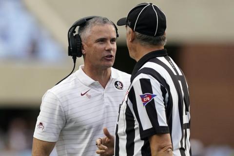 Florida State head coach Mike Norvell speaks with an official during a game against North Carolina on Oct. 9 in Chapel Hill, N.C. (GERRY BROOME/Associated Press)