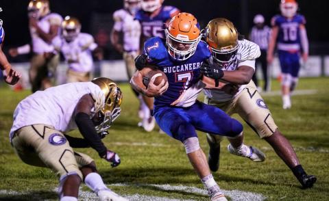 Branford running back Bodhi White is tackled by Zarephath Academy on Sept. 17. (BRIAN LEWIS/Special to the Reporter).