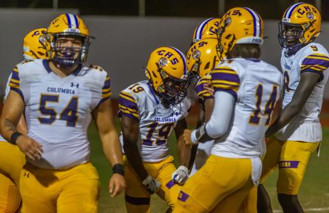 Columbia running back Leo Robinson (19) celebrates with teammates after scoring a touchdown against Orange Park on Friday. (FRAN RUCHALSKI/Special to the Reporter)