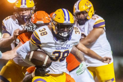 Columbia running back Malik Moore rushes up the field against Orange Park on Friday. (FRAN RUCHALSKI/Special to the Reporter)