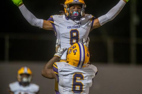 Columbia receiver Jace Hoskey (8) is raised in the air by receiver Tray Tolliver in celebration after Hoskey scored a touchdown against Orange Park on Oct. 15. (FRAN RUCHALSKI/Special to the Reporter)