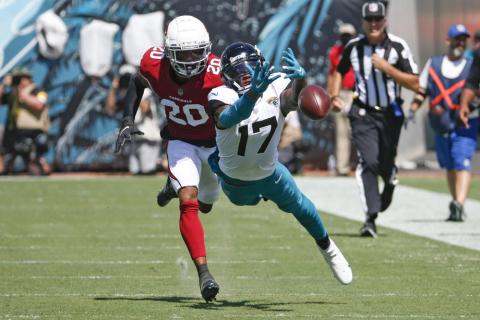 Jacksonville Jaguars wide receiver D.J. Chark dives but can't make a catch as he is defended by Arizona Cardinals cornerback Marco Wilson on Sept. 26 in Jacksonville. (STEPHEN B. MORTON/Associated Press)