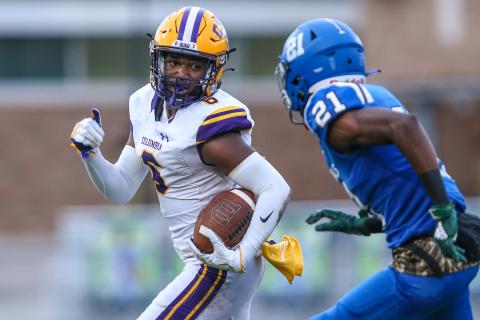 Columbia receiver Tray Tolliver runs up the field pursued by Riverside cornerback Joe Morrison during last Friday's game. (GARY LLOYD MCCULLOUGH/Special to the Reporter)