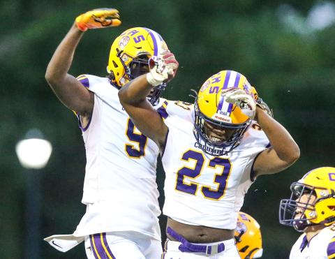 Columbia linebacker Tyrell Peterson celebrates with receiver Brae Deal after a fumble recovery against Riverside on Friday. (GARY LLOYD MCCULLOUGH/Special to the Reporter)