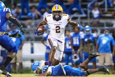 Columbia receiver Marcus Peterson leaps over Riverside linebacker Jamari Allen after a catch on Friday. (GARY LLOYD MCCULLOUGH/Special to the Reporter)